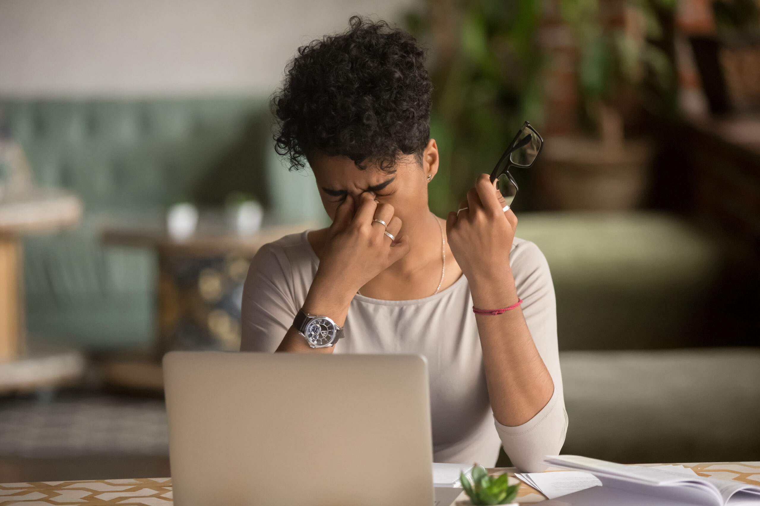 female student worker holding glasses feel eye strain fatigue after computer work